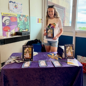 Queen Elect Holly, shown with the 2026 Bo'ness Fair Programme