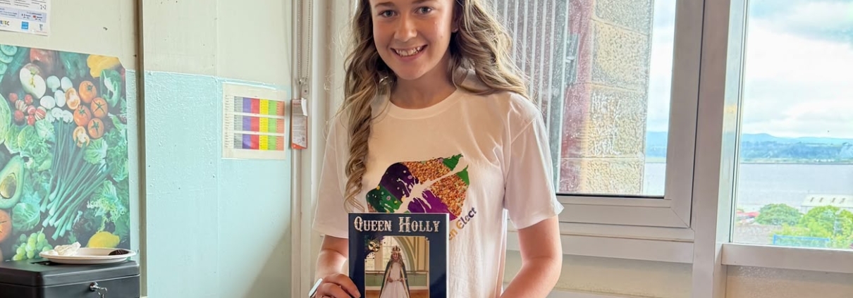 Queen Elect Holly, shown with the 2026 Bo'ness Fair Programme