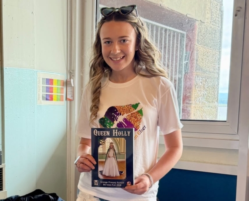 Queen Elect Holly, shown with the 2026 Bo'ness Fair Programme