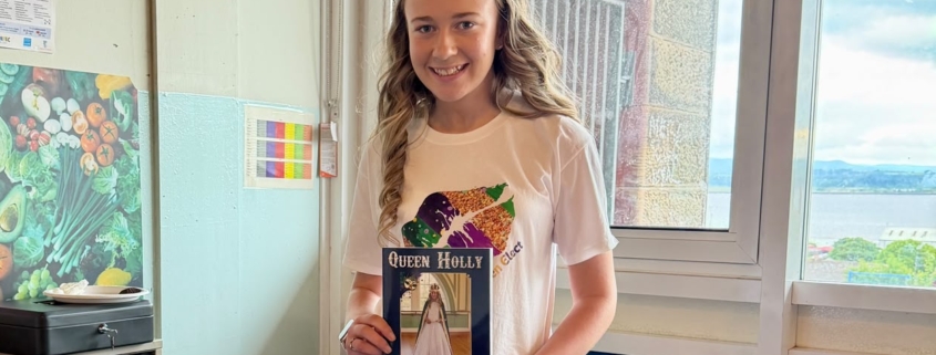 Queen Elect Holly, shown with the 2026 Bo'ness Fair Programme